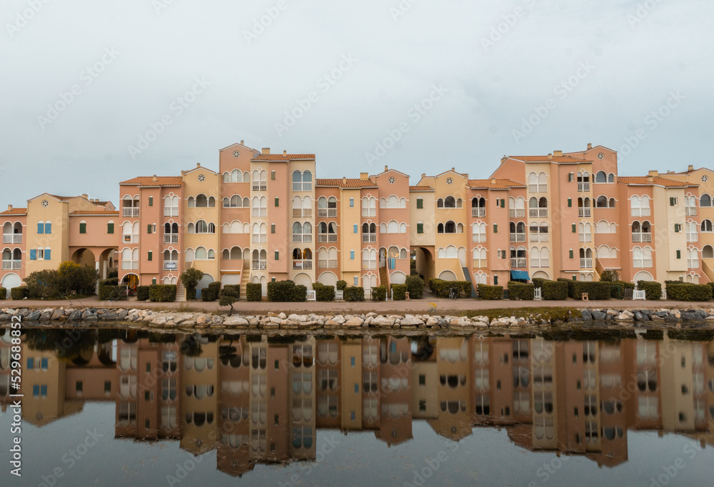 Landscape of orange building with reflection in water Landscape of orange building with reflection in water