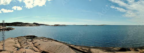 Panoramic view of coastline in nature reserve with sea  rocks and sky