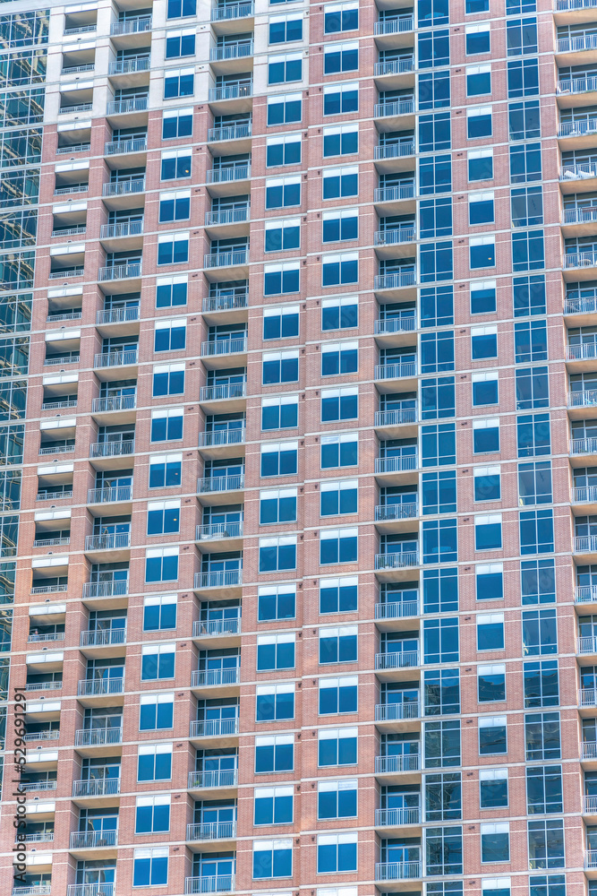 Skyscraper in Austin Texas with glass windows and balconies at the facade