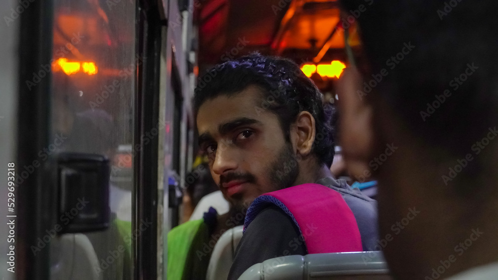 a boy young passenger sitting in the bus