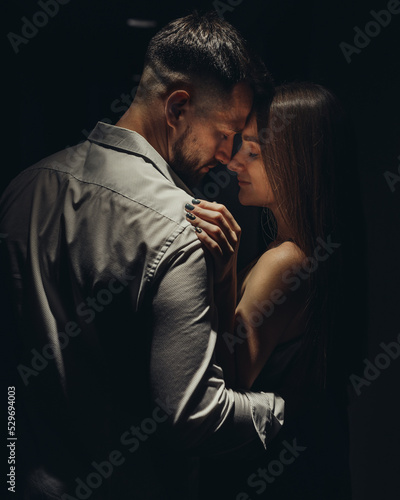 Obraz na płótnie Portrait of couple in love standing face to face in the corridor of the hotel w salonie