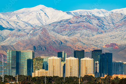Canvas Print Las Vegas skyline in winter with snow capped mountain.