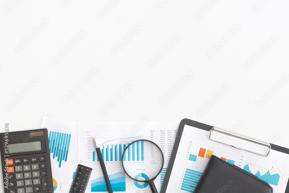 Notebook and calculator on table. Financial development, Banking Account, Statistics