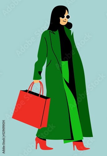 vector trendy flat design image of a beautiful girl in a long green trench coat and light green pants is walking down the street. useful for web, graphic design, print, clothing stores, cards, posters