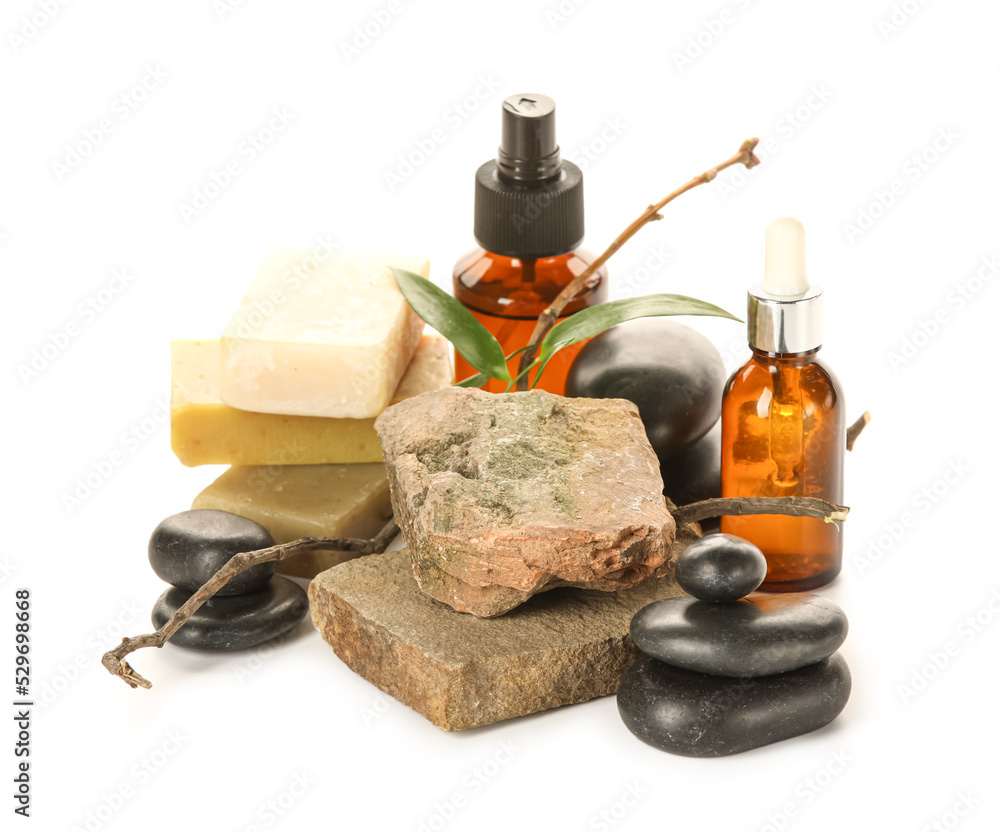 Spa composition with cosmetic products and stones on white background Spa composition with cosmetic products and stones on white background