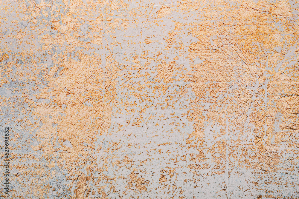 Light wall with golden pattern as background, closeup Light wall with golden pattern as background, closeup