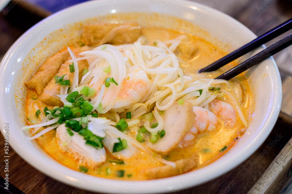 Top view of Vietnamese pho with prawns, chicken and tofu on top. Top view of Vietnamese pho with prawns, chicken and tofu on top.