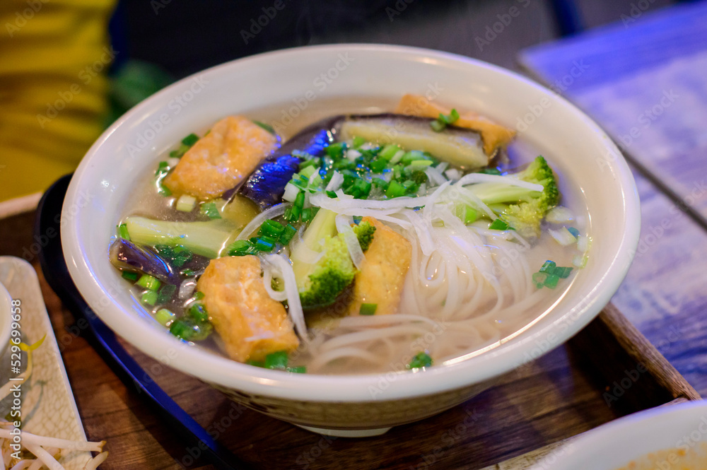 Top view of Vietnamese pho with tofu and vegetable soup. Top view of Vietnamese pho with tofu and vegetable soup.