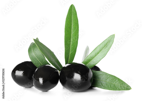 Delicious black olives with leaves on white background