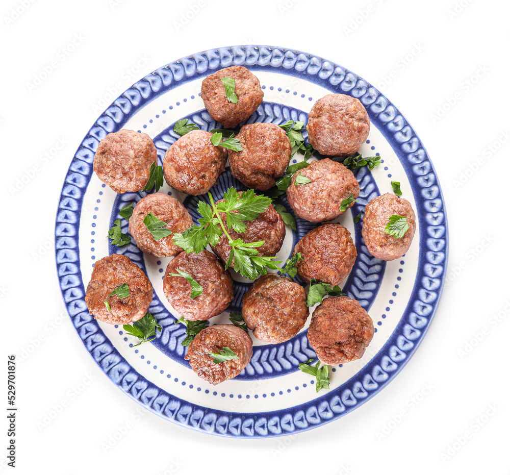 Plate with tasty meat balls and cut parsley on white background Plate with tasty meat balls and cut parsley on white background