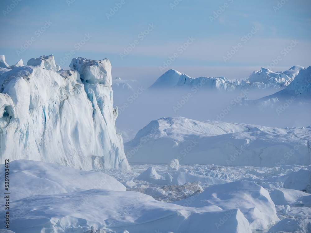 Awe-inspiring icy landscapes at the mouth of the Icefjord glacier (Sermeq Kujalleq), one of the fastest and most active glaciers in the world. A UNESCO world heritage site, Ilulissat, Greenland
