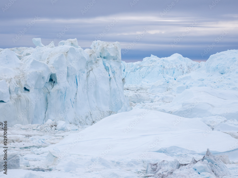 Awe-inspiring icy landscapes at the mouth of the Icefjord glacier (Sermeq Kujalleq), one of the fastest and most active glaciers in the world. A UNESCO world heritage site, Ilulissat, Greenland