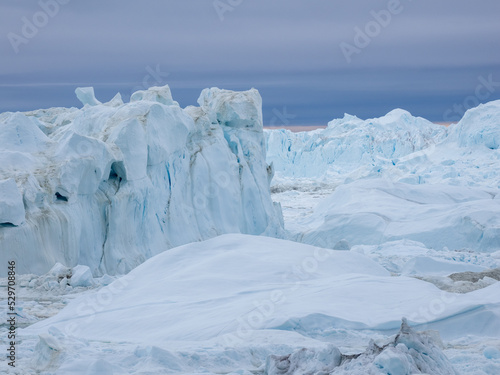 Awe-inspiring icy landscapes at the mouth of the Icefjord glacier (Sermeq Kujalleq), one of the fastest and most active glaciers in the world. A UNESCO world heritage site, Ilulissat, Greenland  © Luis