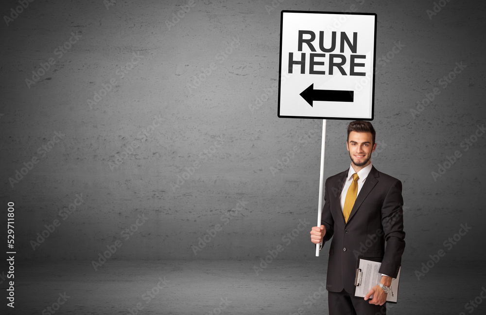 business person holding a traffic sign business person holding a traffic sign