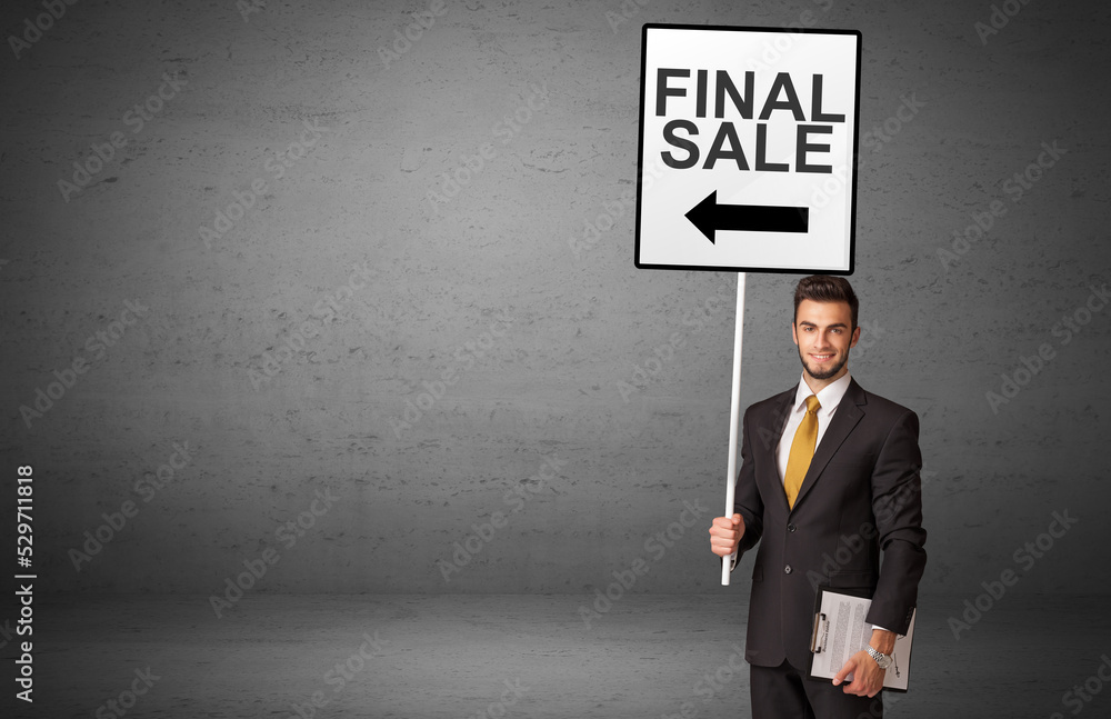 business person holding a traffic sign business person holding a traffic sign