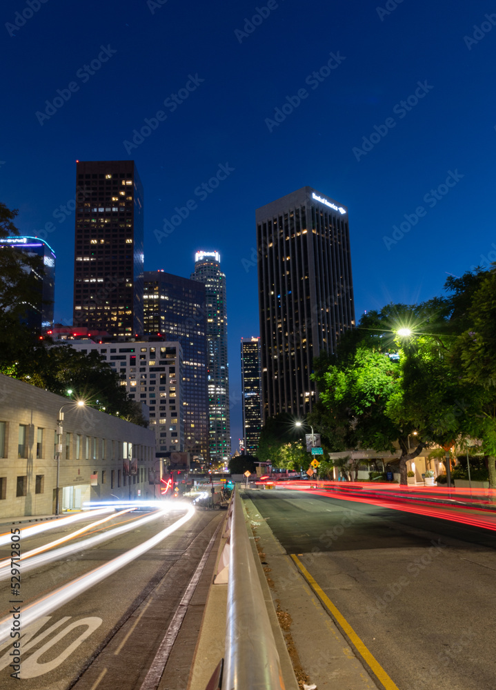 Los Angeles at night with car trails leading down the streets