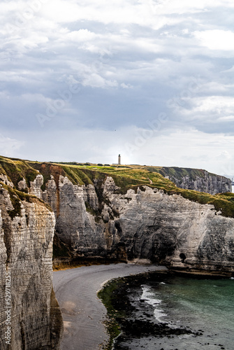 View of Etretat Aval cliff and rocks landmark with lighthouse. Normandy, France. Beautifull landscape Natural amazing cliffs. La Manche