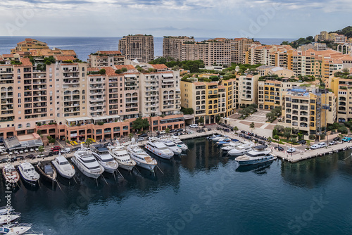 Panoramic view of Fontvieille - district of Monaco with boats and a high-rise apartment complex. Principality of Monaco, French Riviera, Western Europe. © dbrnjhrj