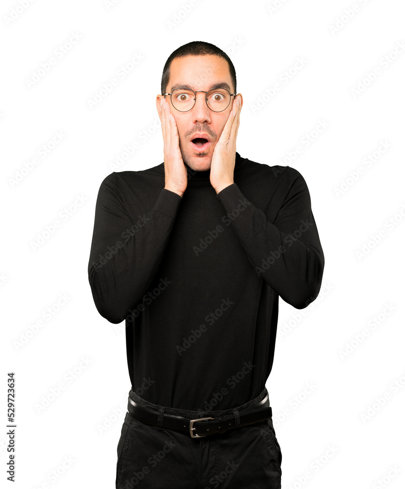 Astonished young man with a gesture of shock Astonished young man with a gesture of shock