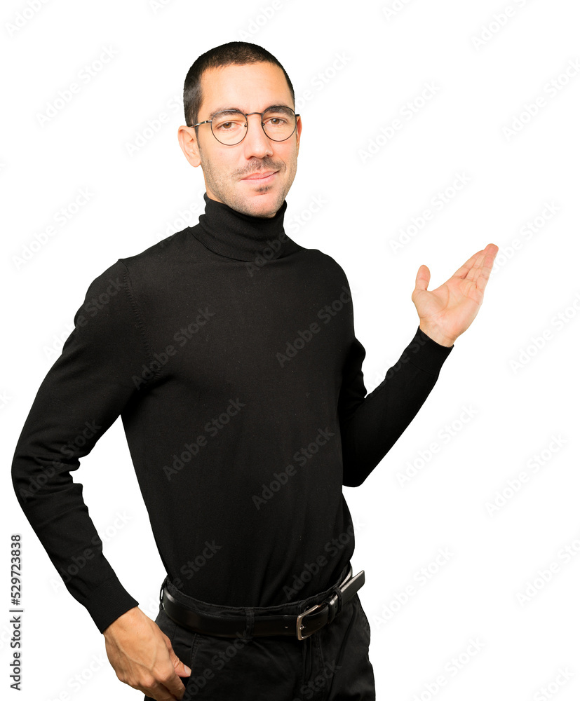 Friendly young man making a gesture of welcome Friendly young man making a gesture of welcome