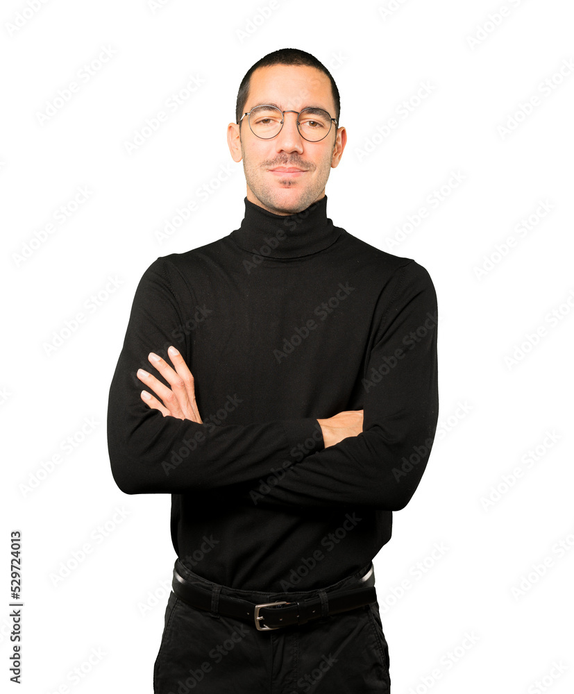 Satisfied young man with crossed arms gesture Satisfied young man with crossed arms gesture