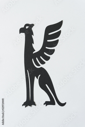 isolated mythological creature glyph  griffon  on blank paper