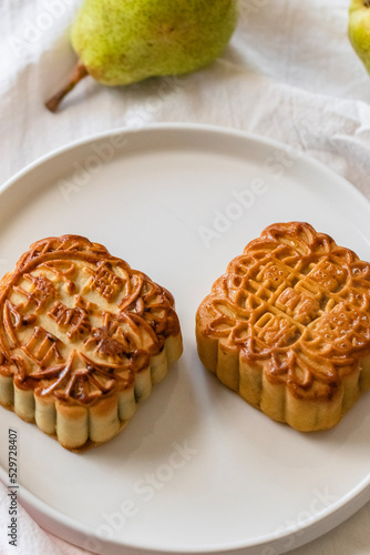 two mooncakes on a plate 