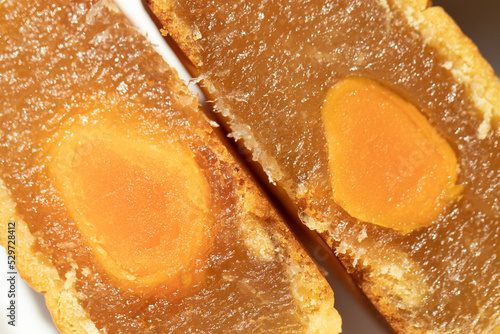 closeup cut mooncake fillings with egg yolk