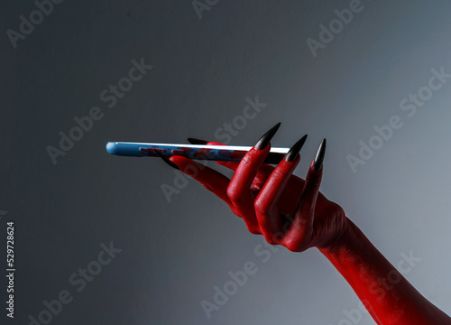 Fotografia Scary female monster hands halloween character red color isolated on white background