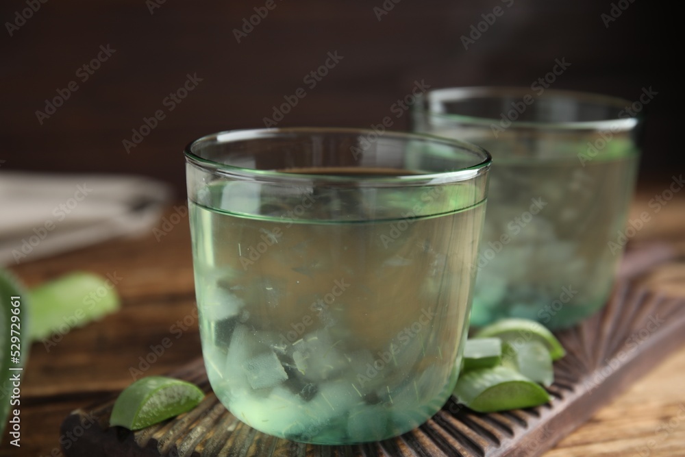 Fresh aloe drink in glasses on table, closeup Fresh aloe drink in glasses on table, closeup