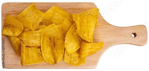 Crispy Banana Chips. Fried or baked sliced banana. Top view of typical traditional dish of Latin American gastronomy called Chifles or fried tostones. Roasted banana. Snack. photo