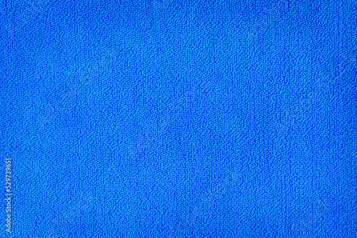 Bright blue seamless generic carpet texture shot from above.