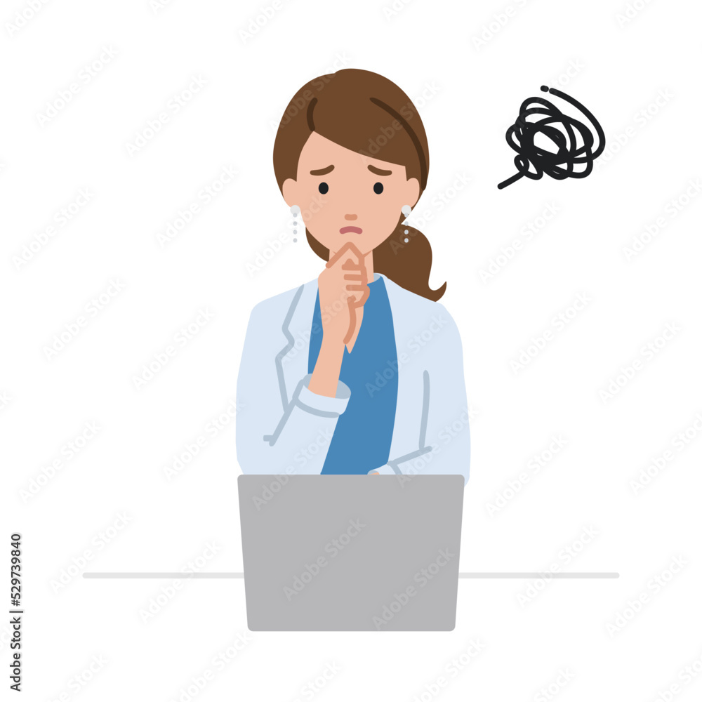 デスクで座ってPCを開いて困っているジャケットの女性