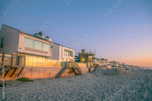La Jolla, California- Beach houses with glass fence during sunset