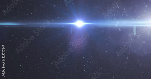Image of glowing blue light moving over spots of light on purple background