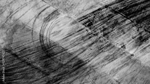 Fotografie Aerial top view texture car skid tire marks on race track, Black tire mark tread marks on race track texture and background