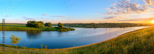 Wide panoramic landscape with calm river