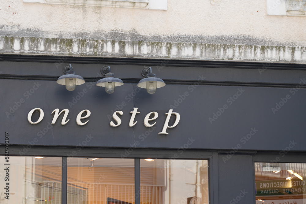 one-step-logo-sign-and-brand-text-on-store-facade-clothing-shop
