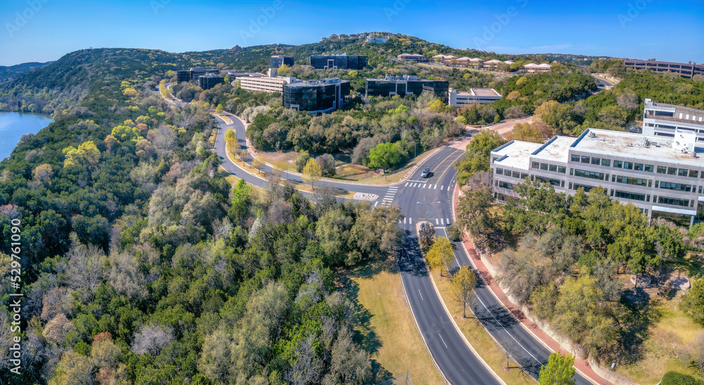 Austin, Texas- Aerial view of business buildings in the middle of forest near the river Austin, Texas- Aerial view of business buildings in the middle of forest near the river