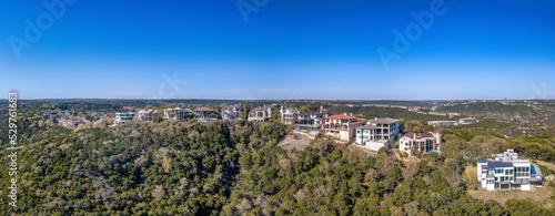 Austin, Texas- Mansions on top of a mountain in an aerial panoramic view