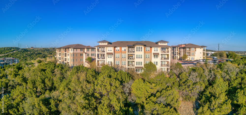 Austin, Texas- Apartment complex on a mountain top against the blue sky background