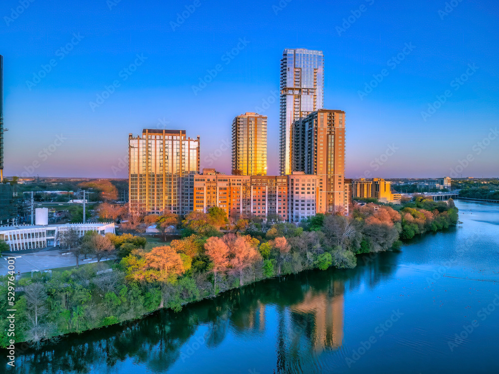 Austin, Texas- Colorado River with a reflection of the buildings with sunset glow