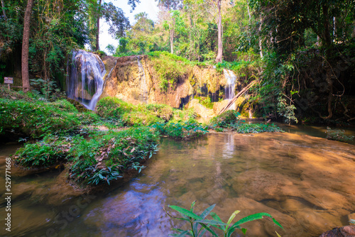 Serenity waterfall in tropical rain foerst mountain nature landscape photo