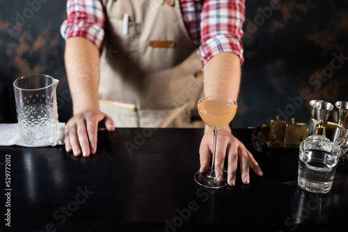 Barman at work, preparing cocktails. concept about service and beverages.