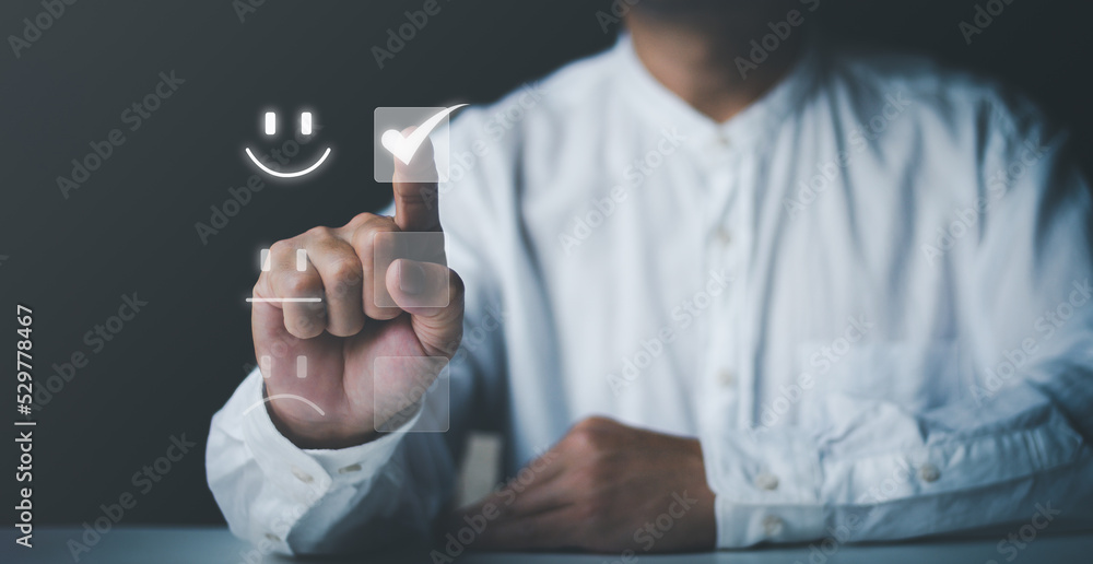 Man give rating check box and smiley face symbold, satisfaction concept . Man give rating check box and smiley face symbold, satisfaction concept .