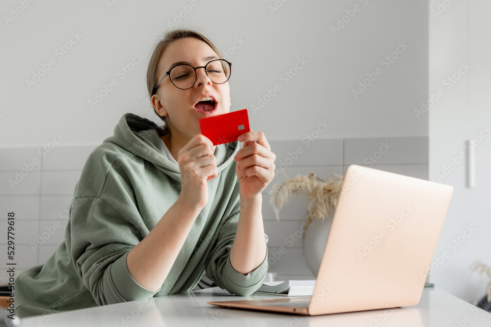 young woman shopping online with credit card young woman shopping online with credit card