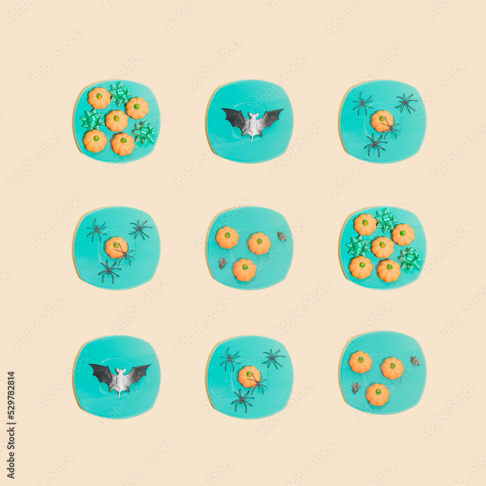Retro Halloween pattern. Turquoise color plates with pumpkins, spiders, bat, ribbons and flies. Vintage aesthetic background. Retro Halloween pattern. Turquoise color plates with pumpkins, spiders, bat, ribbons and flies. Vintage aesthetic background.