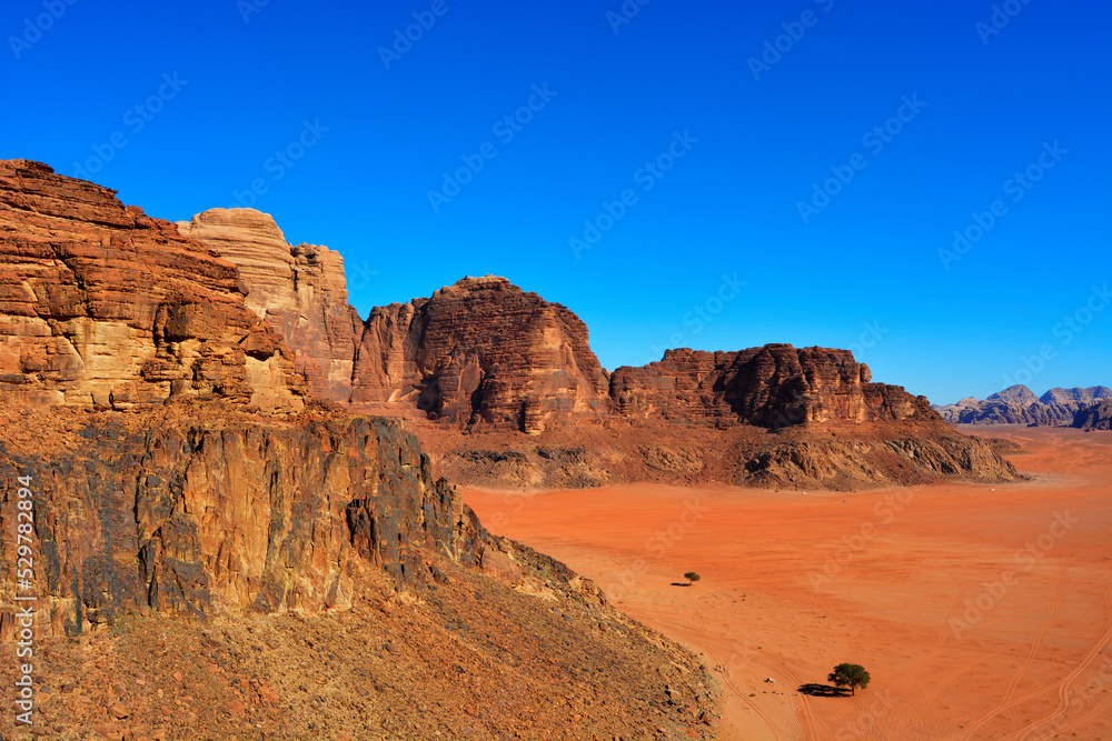 Amazing desert landscape. Beautiful landscape of desert mountains. Monolithic mountains in the central part of the desert. Wadi Rum, Jordan.