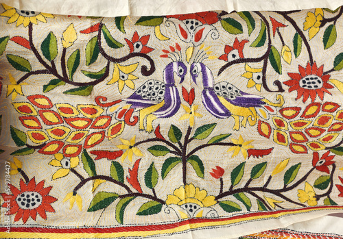 Closeup of of intricately embroidered Tussar sari, (traditional dress worn by Indian women). This style of design is known as Kantha Stitch particularly in Bengal & immensely popular among tourists 