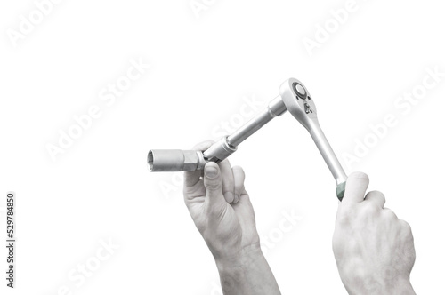 place for text on the background of a wrench in a hand. the banner depicts hands holding tools.hand of the master holds an adjustable wrench